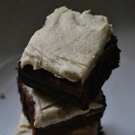 stack of brownies with light cashew butter frosting