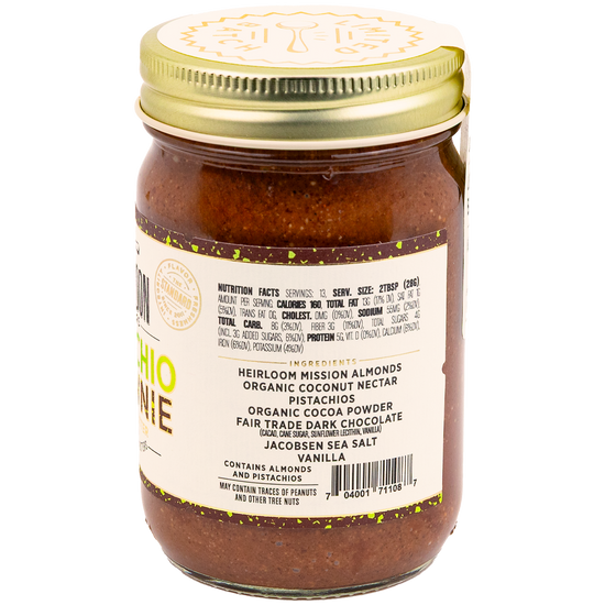 Jar of Pistachio Brownie Almond Butter showing ingredients and nutrition info
