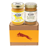 Two jars of Big Spoon Roasters nut butter - Banana Flax Wag Butter and Almond Butter with Wildflower Honey on a branded box 