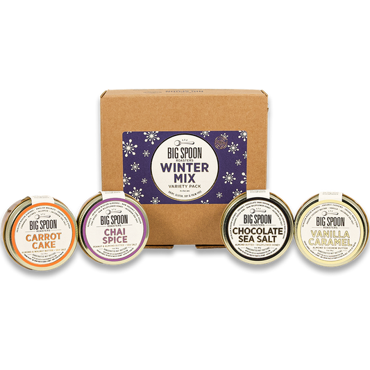 3oz Winter Mix Variety Pack box with mini jars of Carrot Cake Almond & Walnut Butter, Chai Spice Peanut & Almond Butter, Chocolate Sea Salt Almond Butter, and Vanilla Caramel Almond & Cashew Butter in front