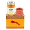 Jar of Vanilla Tater Wag Butter and a red West Paw Toppl toy on top of a gift box