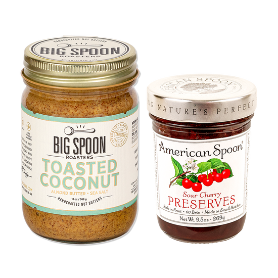 One jar of peanut butter from Big Spoon Roasters and one jar of sour cherry preserves from American Spoon on white background