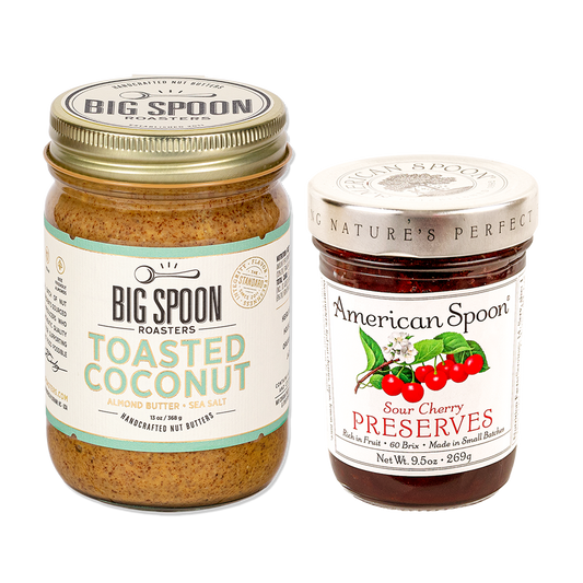One jar of peanut butter from Big Spoon Roasters and one jar of sour cherry preserves from American Spoon on white background