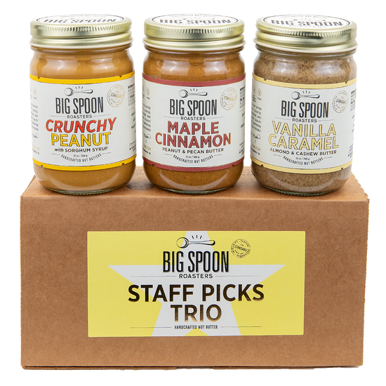 Staff Picks Nut Butter Trio box with three jars—Crunchy Peanut Butter, Maple Cinnamon Peanut & Pecan Butter, and Vanilla Caramel Almond & Cashew Butter—atop.