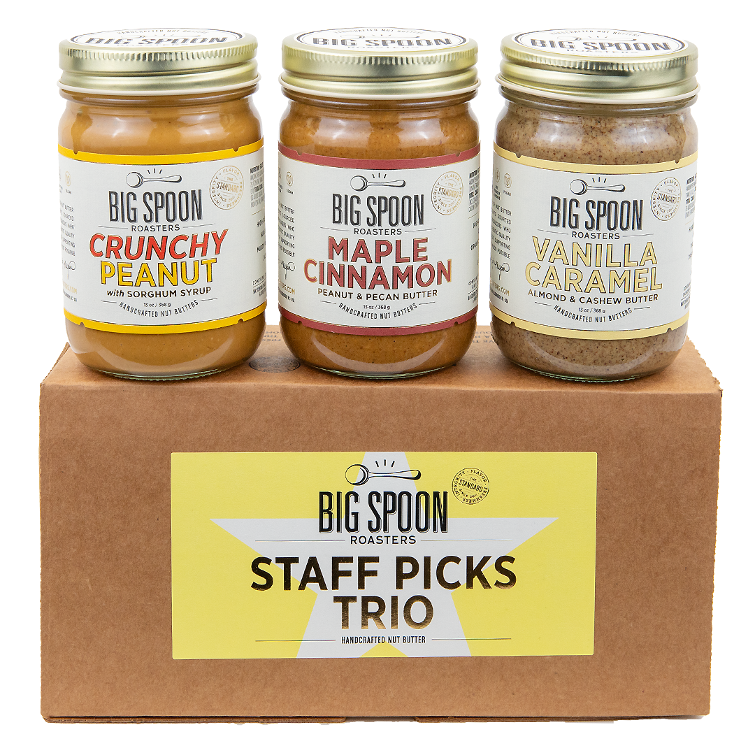 Staff Picks Nut Butter Trio box with three jars—Crunchy Peanut Butter, Maple Cinnamon Peanut & Pecan Butter, and Vanilla Caramel Almond & Cashew Butter—atop.